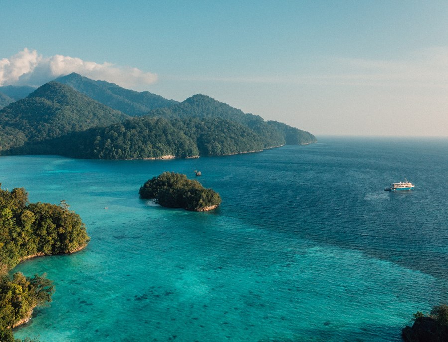 Towering Limestone Islands Rise Above Turquoise Tropical Seas