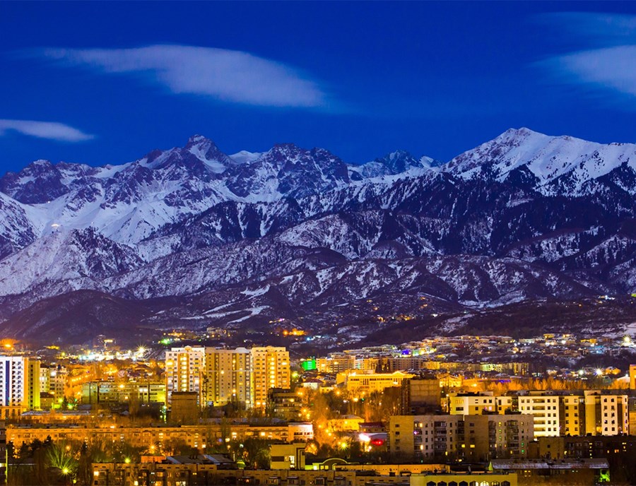 Almaty Sparkles Beneath The Majestic Tian Shan Mountains