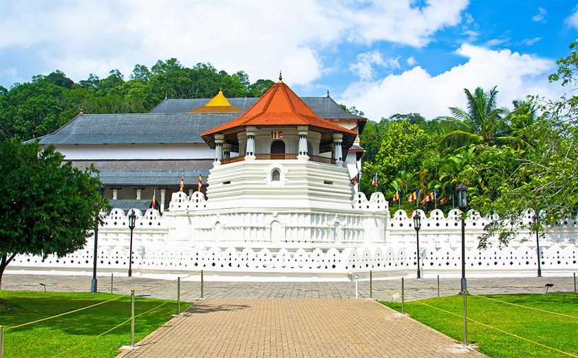Visit the sacred Temple of the Tooth in Kandy, a UNESCO World Heritage Site