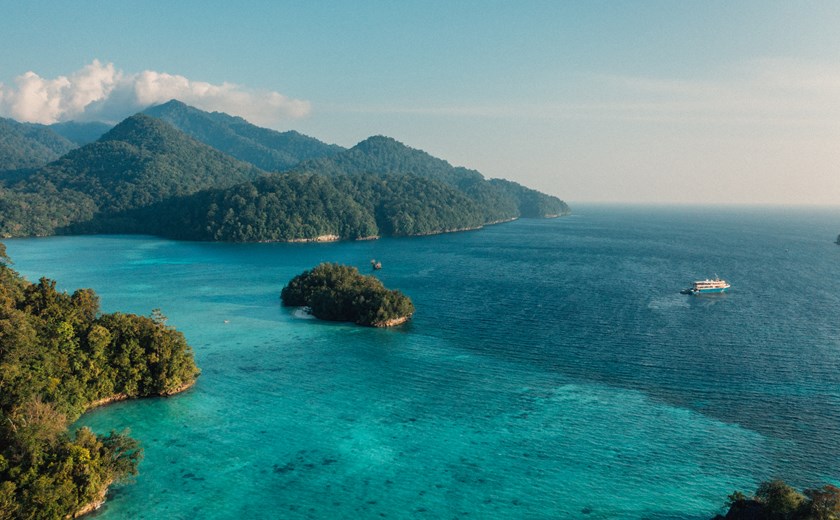 View of Misool’s iconic limestone cliffs and turquoise lagoons from the Kudanil Explorer.