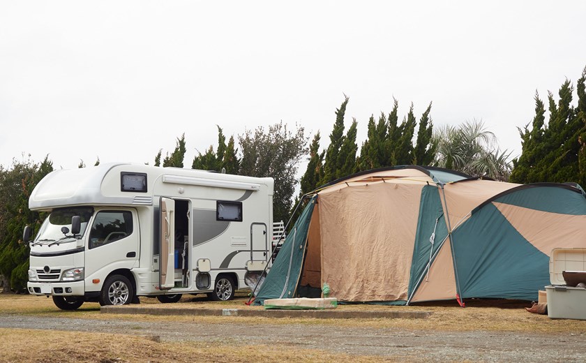Campervan in Osaka and a tent set up for outdoor camping