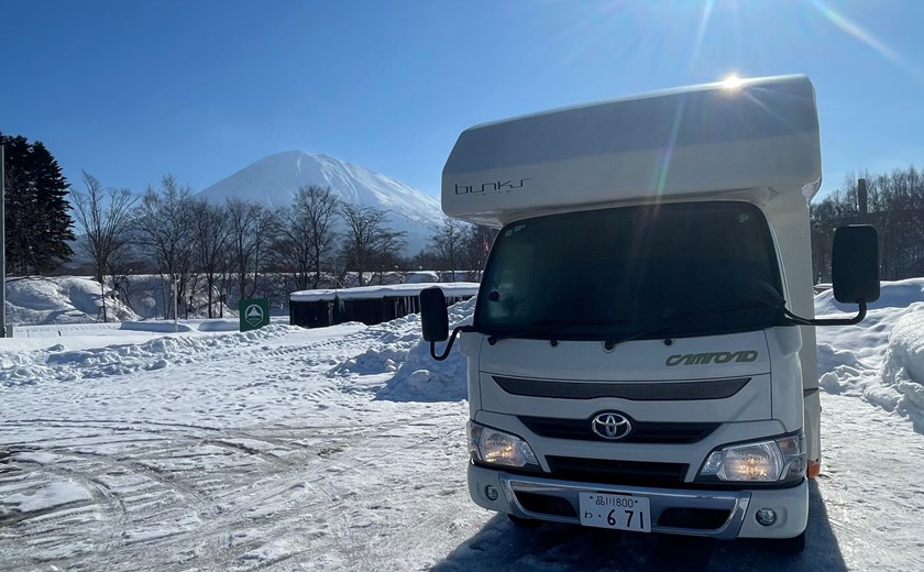 Osaka campervan parked in a winter landscape with snow-covered surroundings