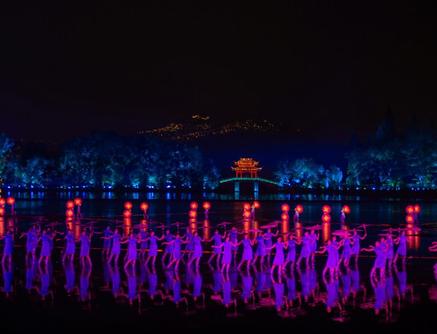 Enjoy a spectacular Impression West Lake Night Show performance combining music, light, and dance on the lake.jpg