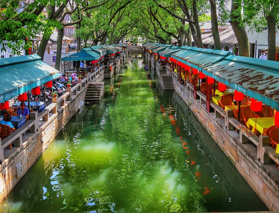 Glide along Tongli’s peaceful canals, past stone bridges and traditional waterfront homes in Shanghai.jpg
