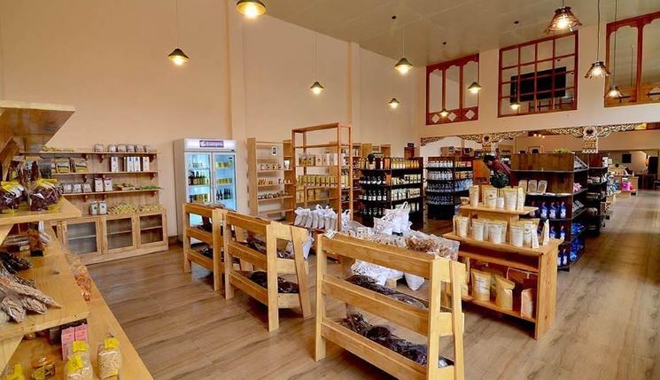 Interior of Bhutan's CSI Cottage & Small Industry Market, showing wooden shelves with local products for sale
