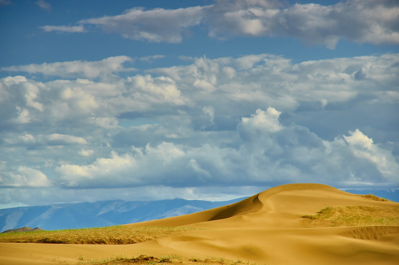 Elsen Tasarkhai Dunes Meeting Endless Steppe Beneath Mongolian Skies